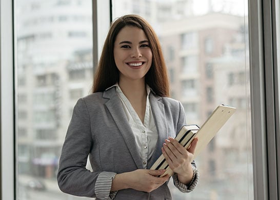 Happy professional woman at work.