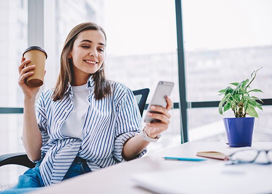 Young woman banking on her mobile phone.