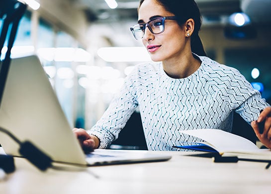 Woman on computer doing research.