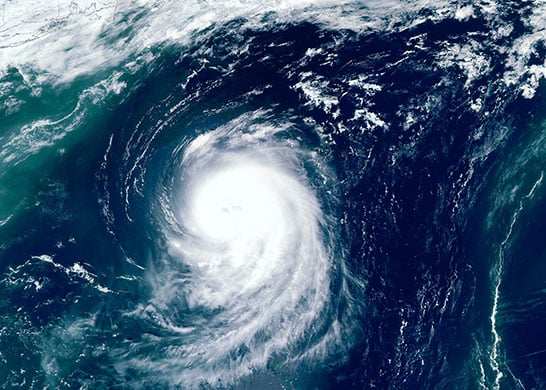Satellite photo of hurricane forming off coast.