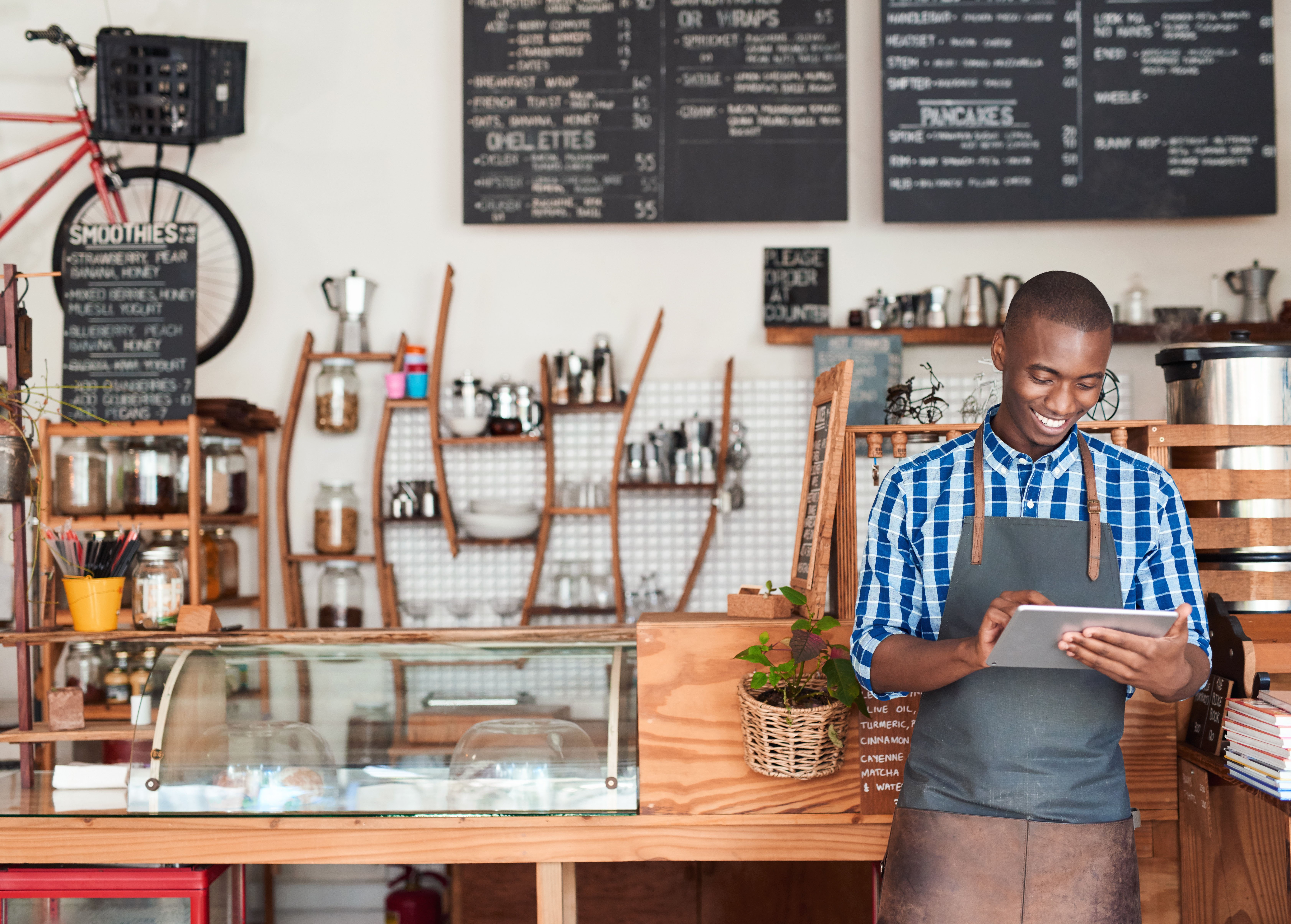 Small business owner looking at a tablet