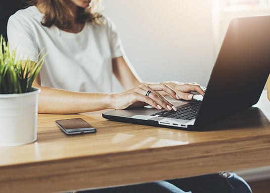 Woman working from home on her laptop.