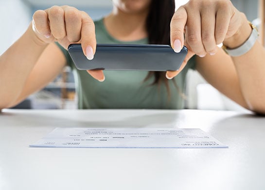 Woman Mobile Depositing a Check 