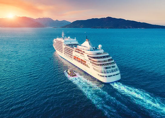 Cruise ship sailing through open waters.