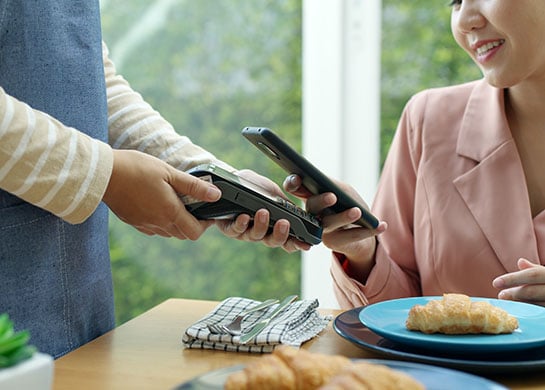 Women making payment from her smart phone