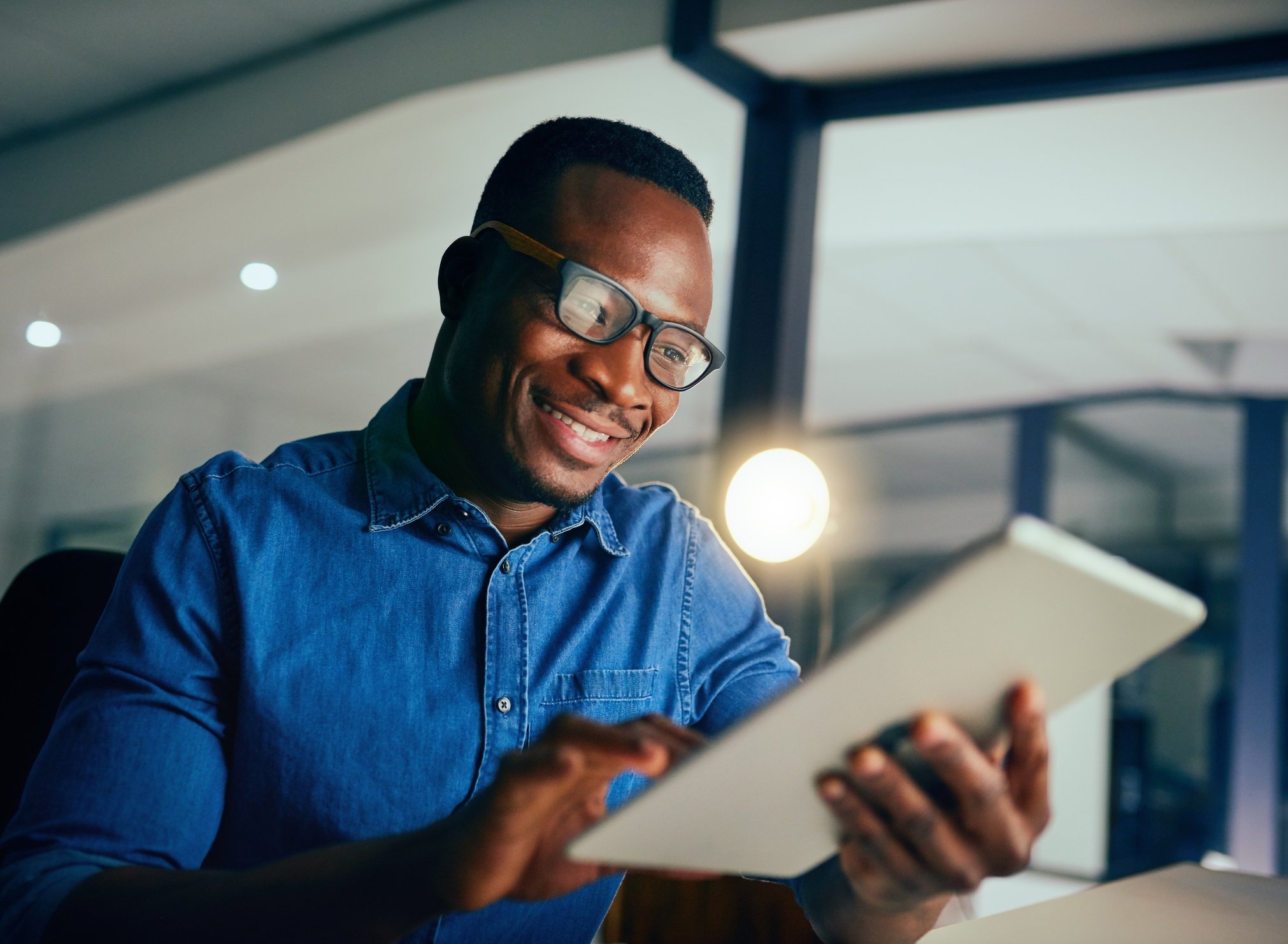 Man looking at ways to improve his financial health on an ipad image