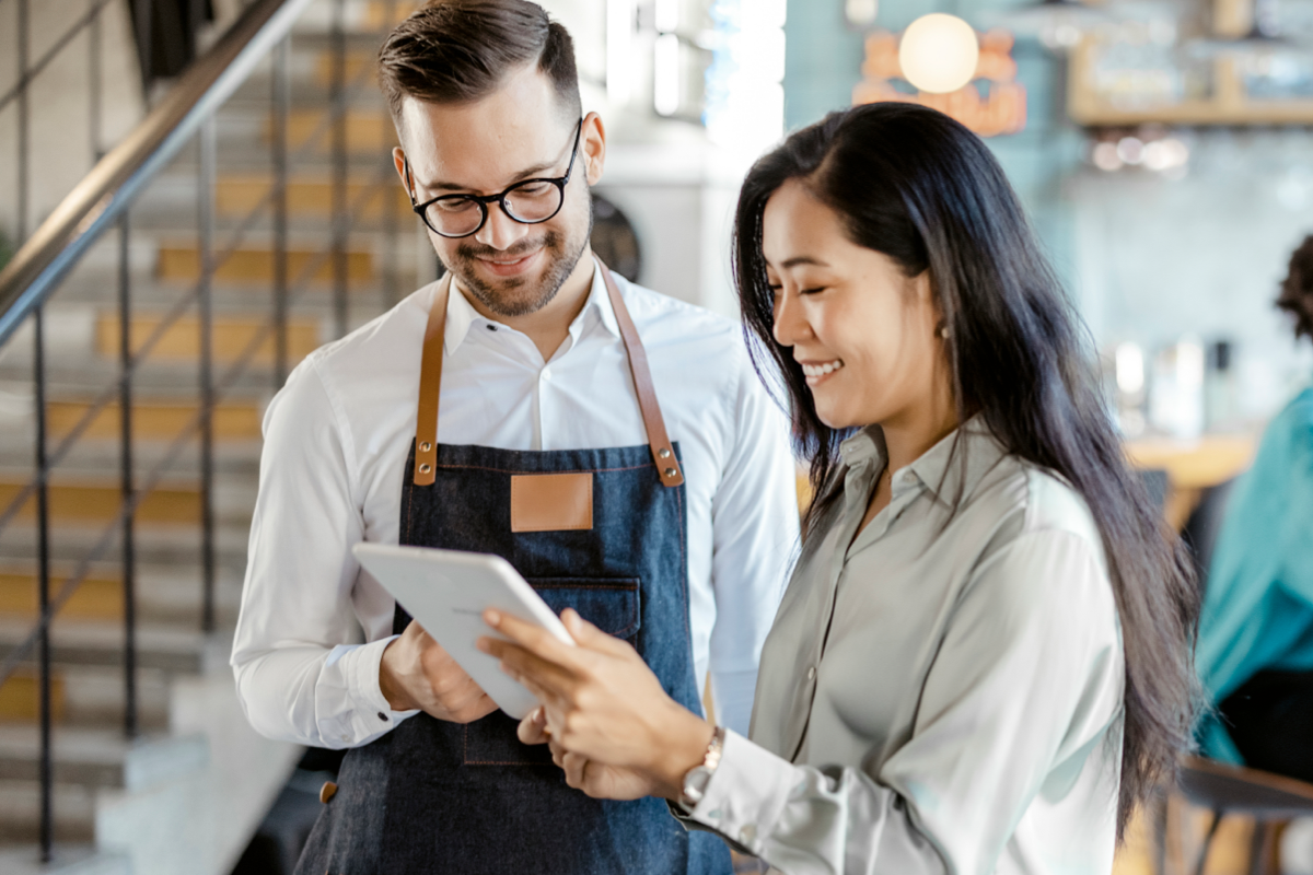 couple holding notebook