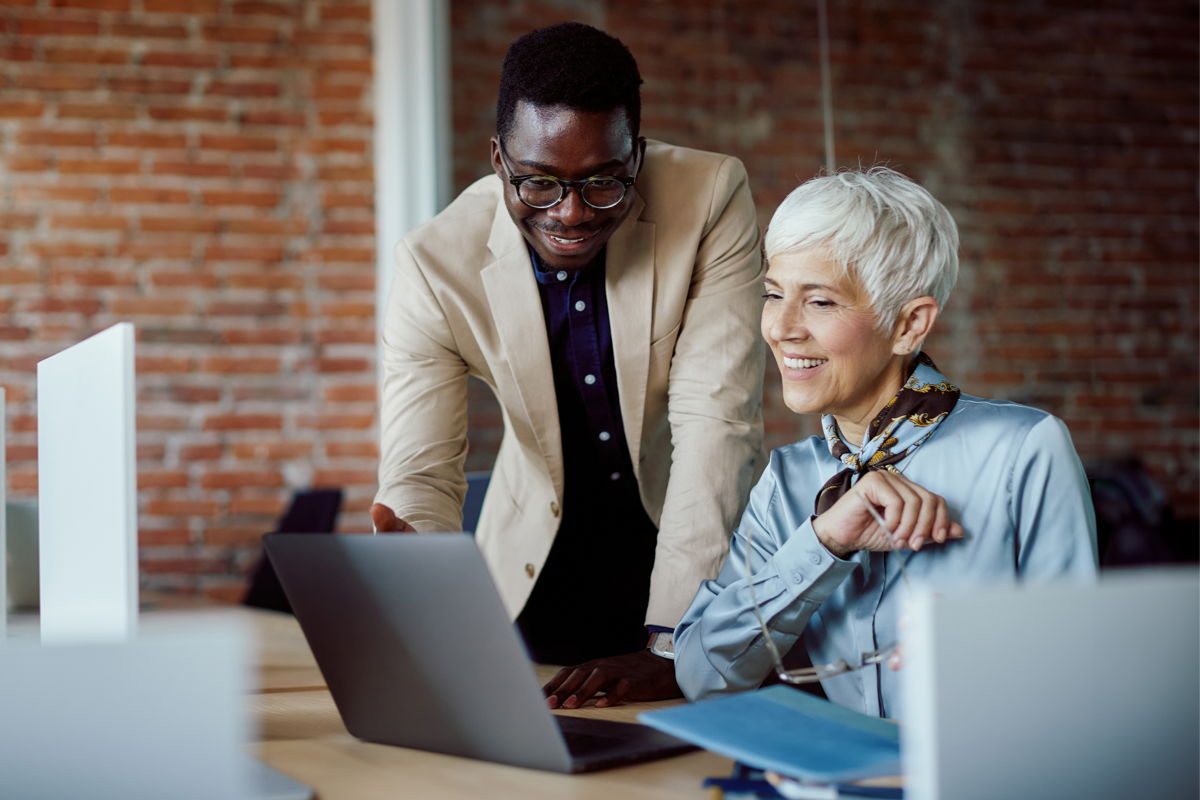 man and lady working on laptop