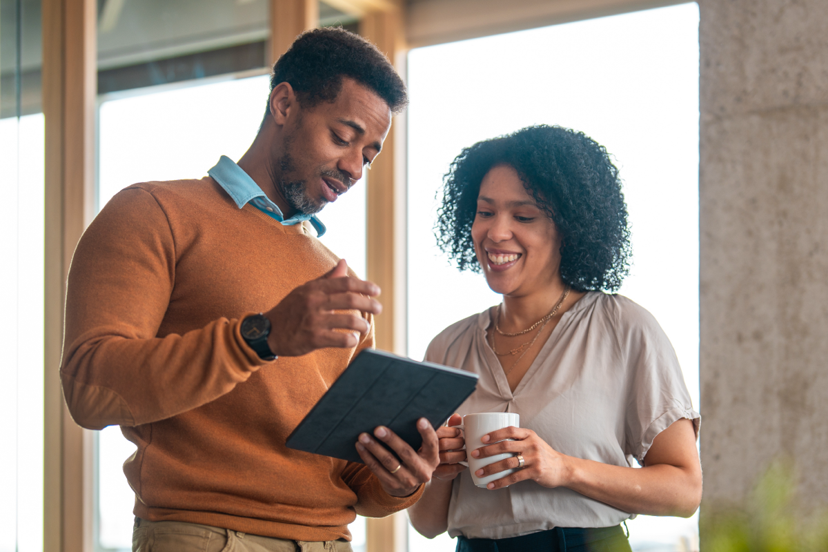 couple looking at notebook