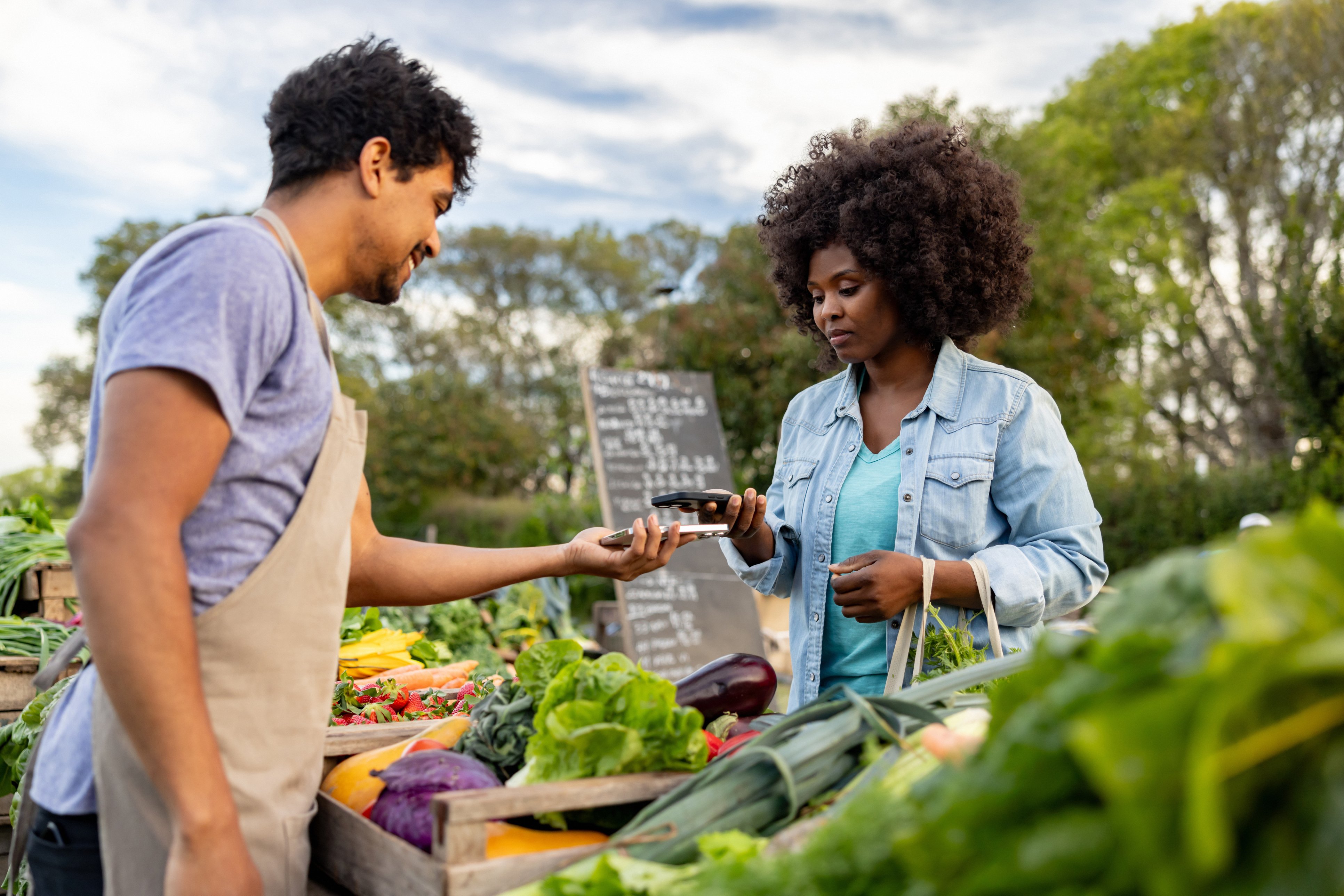 Lady using instant payment at market