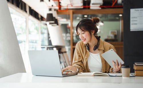 Asian small business businesswoman working on laptop computer image