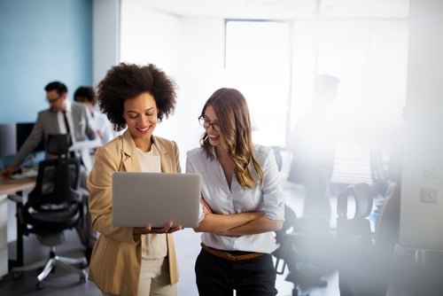 Happy smiling business women working together in office image