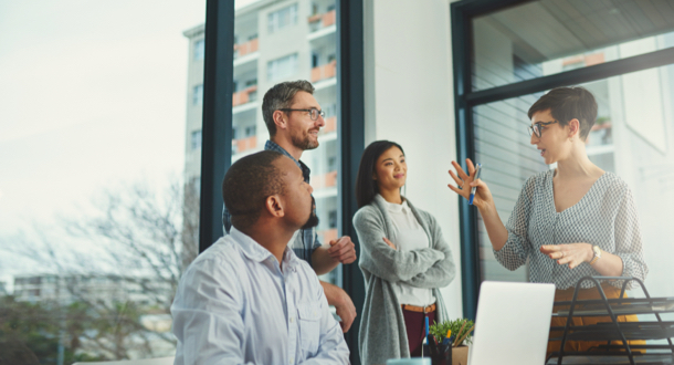 Group of colleagues having a discussion in the office