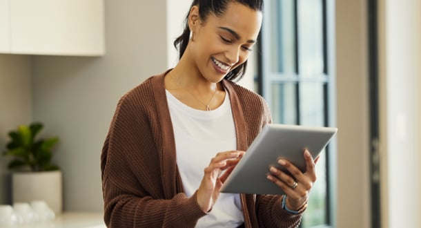 young woman using a digital tablet at home