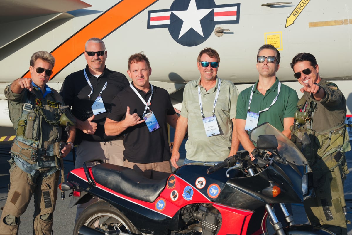 Co workers taking picture with bike image