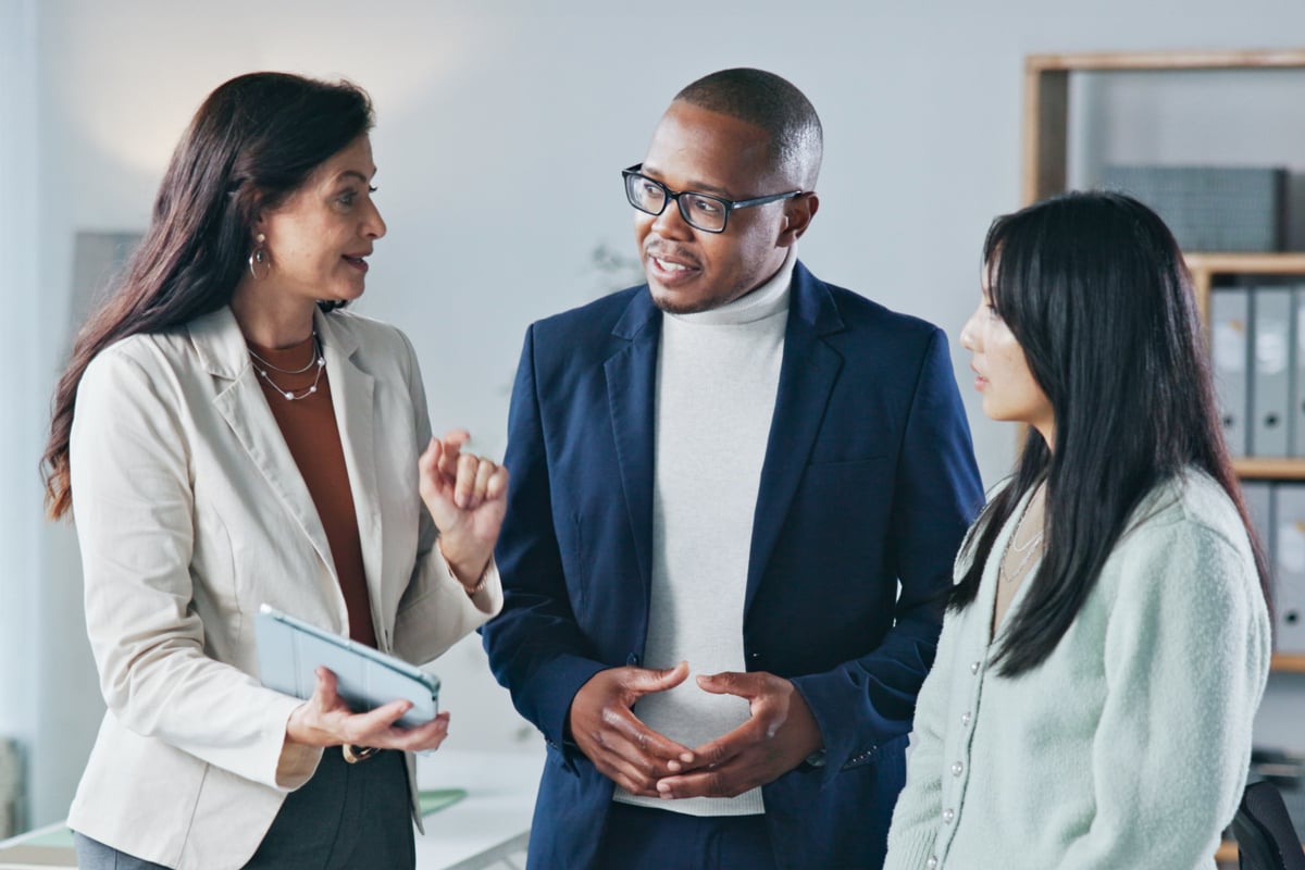 team-discussing-bank-director-survey-insights image