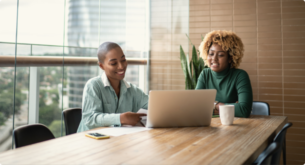 female digital banking service provider talking to customer in office