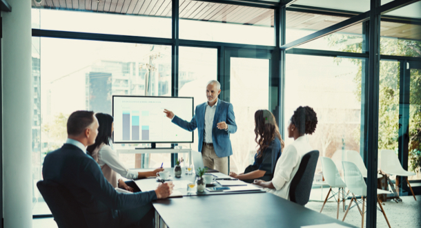 businessman presenting to clients in office