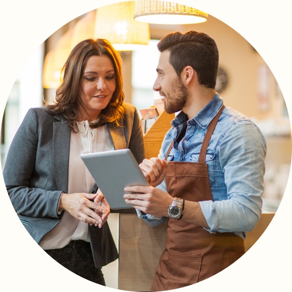 business women working with client holding tablet
