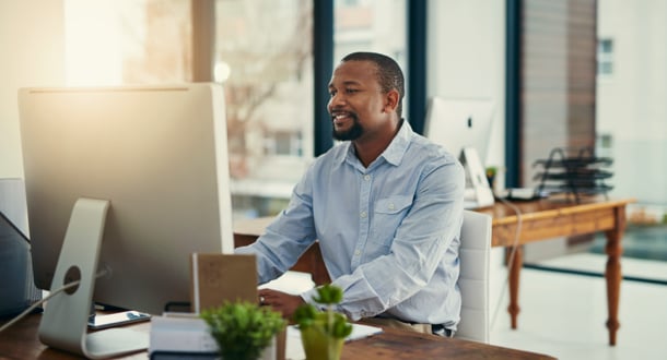 Man working on desktop in an office