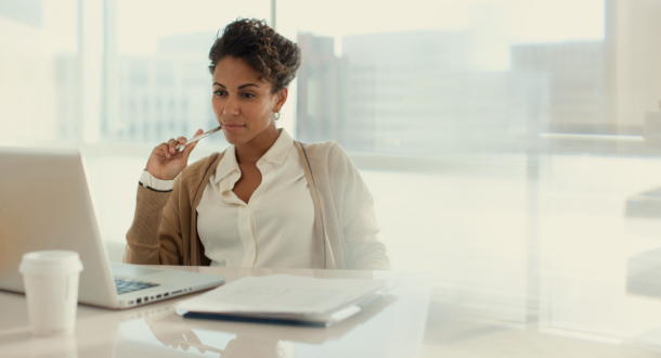 Businesswoman using laptop in office